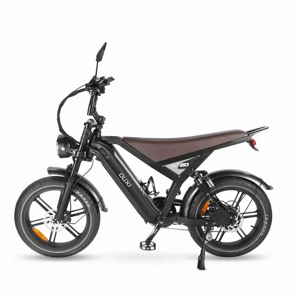 Fatbike Ouxi GT20 negra, vista lateral izquierda sobre la pata de cabra con frenos de disco y suspensión trasera
